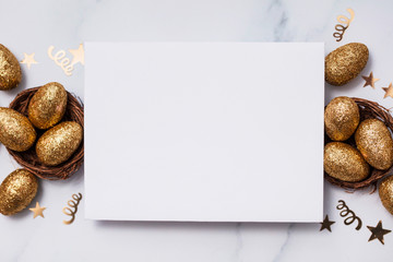 Easter composition. Blank card with gold eggs and nests