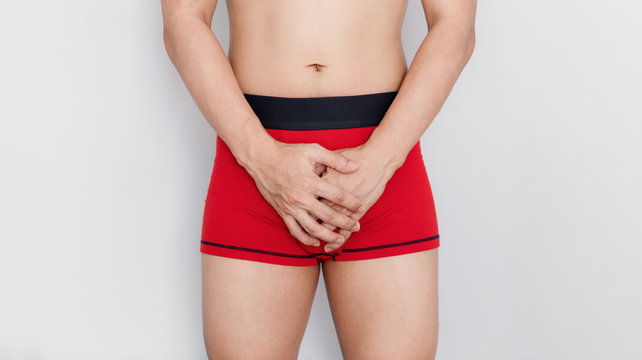 Close-up a man in red underwear. Men health, and sexual dysfunction problem 