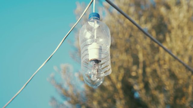 Light bulb waterproofed with water bottle innovative way in refugee camp