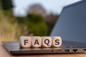 Cubes on a notebook form the abbreviation 