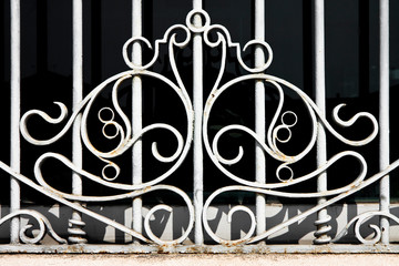 Old wrought iron grating with floral decorations