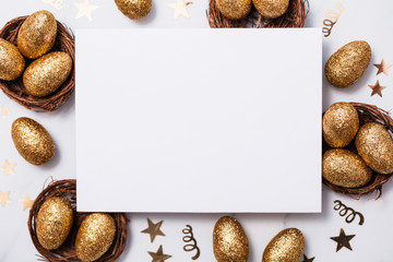 Easter composition. Blank card with gold eggs and nests