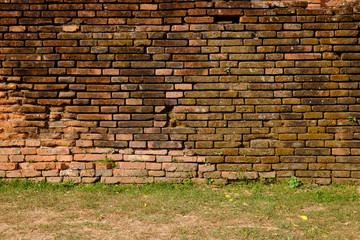 old brick wall with grass