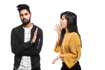 Indian young couple quarreling isolated on white background