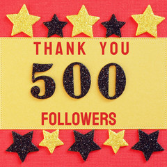 Thanks 500 followers. message with black shiny numbers on red and gold background with black and golden shiny stars for social network friends, followers,.likes..