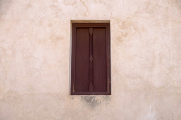 Fototapeta na wymiar old wood window on grunge wall