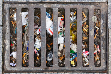 Sewer full of garbage. Urban pollution. Waste treatment. Environmental