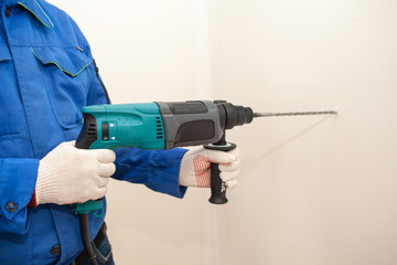 working the wall drill impact drill, hammer