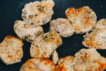 Fried chicken breast. Chicken breast in a pan. Chicken with spices.
