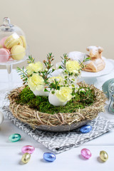 How to make Easter table centerpiece with carnations, wax flower, eggs and moss