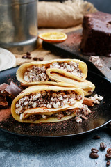 Crepes filled with chocolate and cottage cheese.