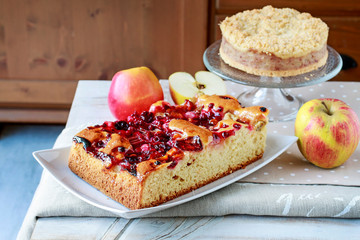 Party table with rhubarb cake and apple pie.