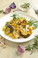 Roasted cauliflower with chickpeas, zucchini noodles and rosemary, salad, vertical 