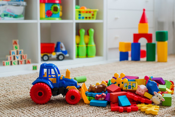 Children's playroom with plastic colorful educational blocks toys.