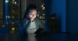 Woman look at smart phone at night