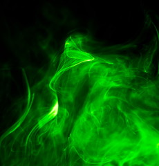 Green smoke on black background