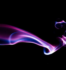 Purple smoke on black background