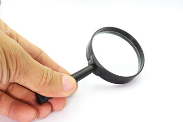 Hand holding Magniflying glass isolated on white background.