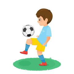 Boy soccer player in uniform with a soccer ball.
