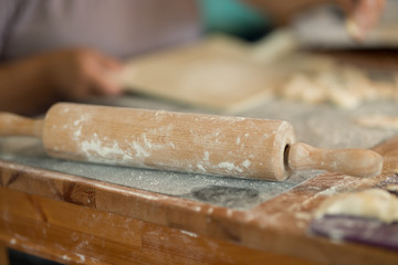 closeup of spin roll for dough laying on the table in the kitchen