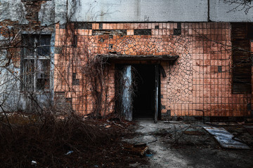 Fototapeta na wymiar Abandoned doorway to Jupiter Factory in Chernobyl Exclusion zone