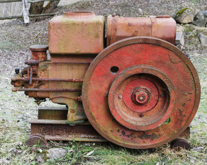 Rusty  vintage  small  tractors  diesel engine  in forgotten village.