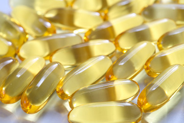 Bunch of Yellow fish oil capsules, omega 3