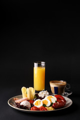 Still life breakfast with orange juice and cup of coffee.