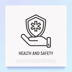 Health and safety thin line icon: hand holding shield with medical symbol. Modern vector illustration.