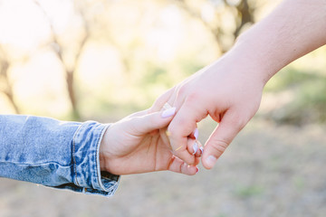 young couple holding hands
