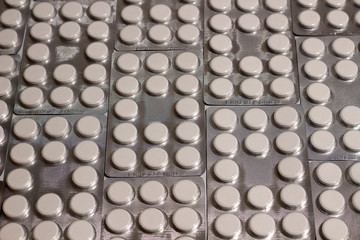A Background Texture of Large White Pills in Blister Packs