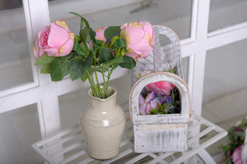 white jug with pink roses