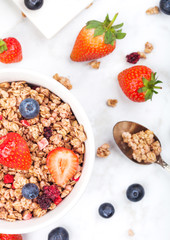Bowl of healthy cereal granola with strawberries
