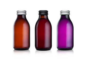 Glass bottles of botanical energy drink on white