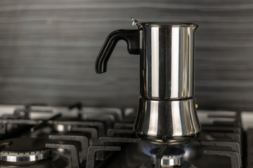 Geyser coffee maker from aluminum on the stove