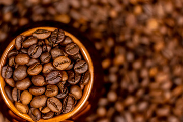 Cup of coffee beans, on old rusty background. Soft focus, copy space.