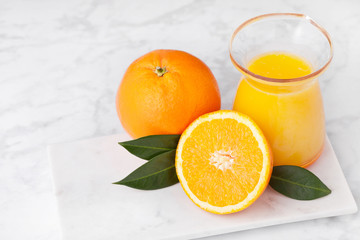 Plastic jar of fresh orange juice with fruits