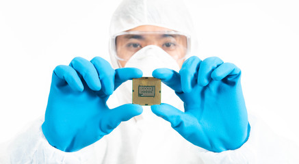 Electronic Manufacturing Factory Design Engineer in Sterile Coverall Holds Microchip with Gloves...
