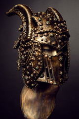 Mannequin in dark bronze helmet