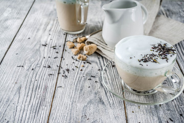Tea latte, Earl Grey Hot London Fog Tea Drink with Foamed Milk, wooden background copy space