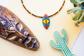 african flat lay with mask and choker