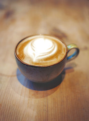 Cup of latte on the table