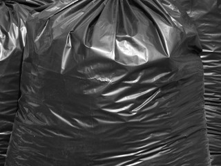 pile of black garbage bags