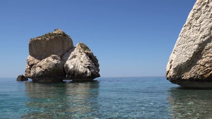 Large stones above the water. Large rocks on the shore of the Sea
