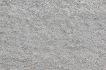 The wall covered with gray rough plaster. Background. 