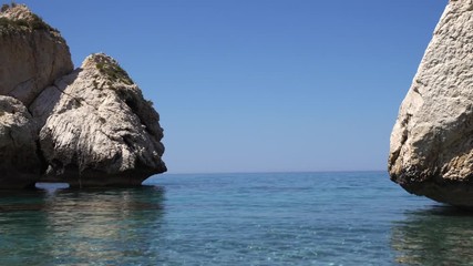Large stones above the water. Large rocks on the shore of the Sea