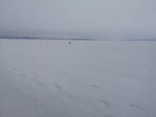 Empty winter landscape. Deep sky and snow on the frozen sea