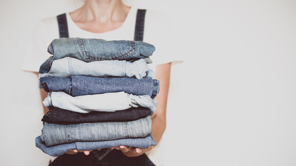 jeans in her hands