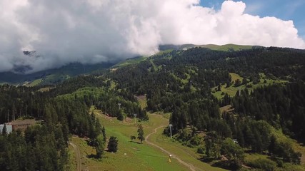Beautiful valley in Altai mountains, aerial view. Mountain taiga, mountains in the clouds, Altai
