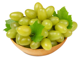 Green grapes on the plate isolated on white